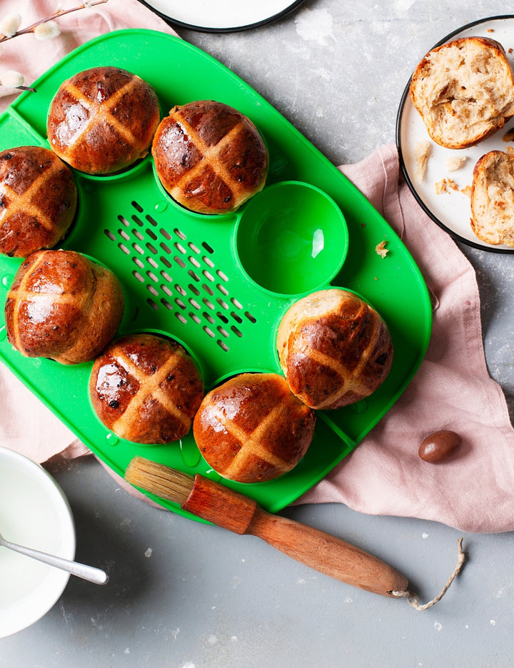 Green Thermomix The Nester silicone insert inside the Varoma tray for cooking and food preparation.