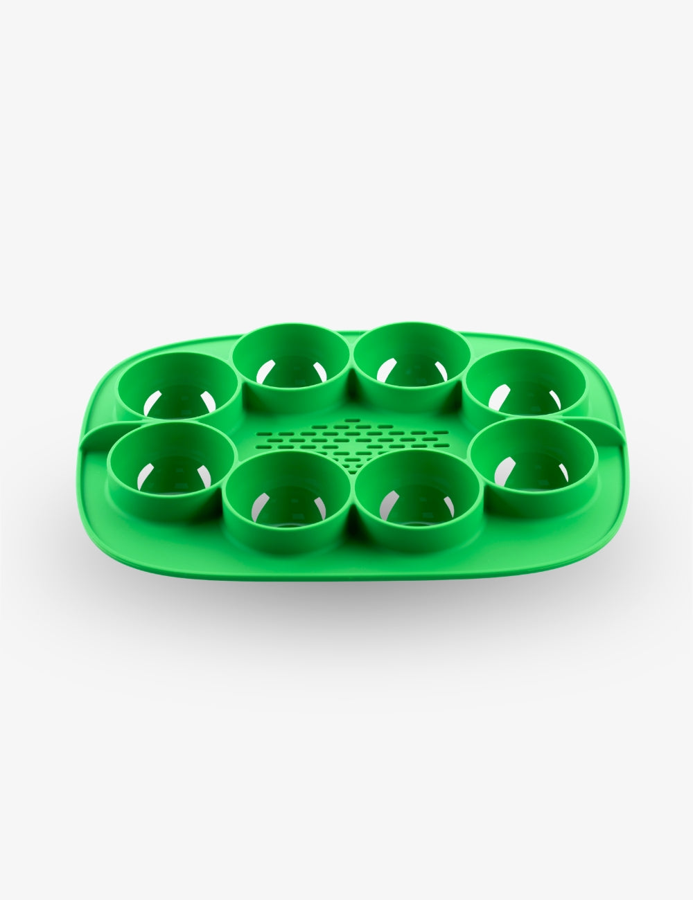 Green Thermomix The Nester silicone insert inside the Varoma tray for cooking and food preparation.