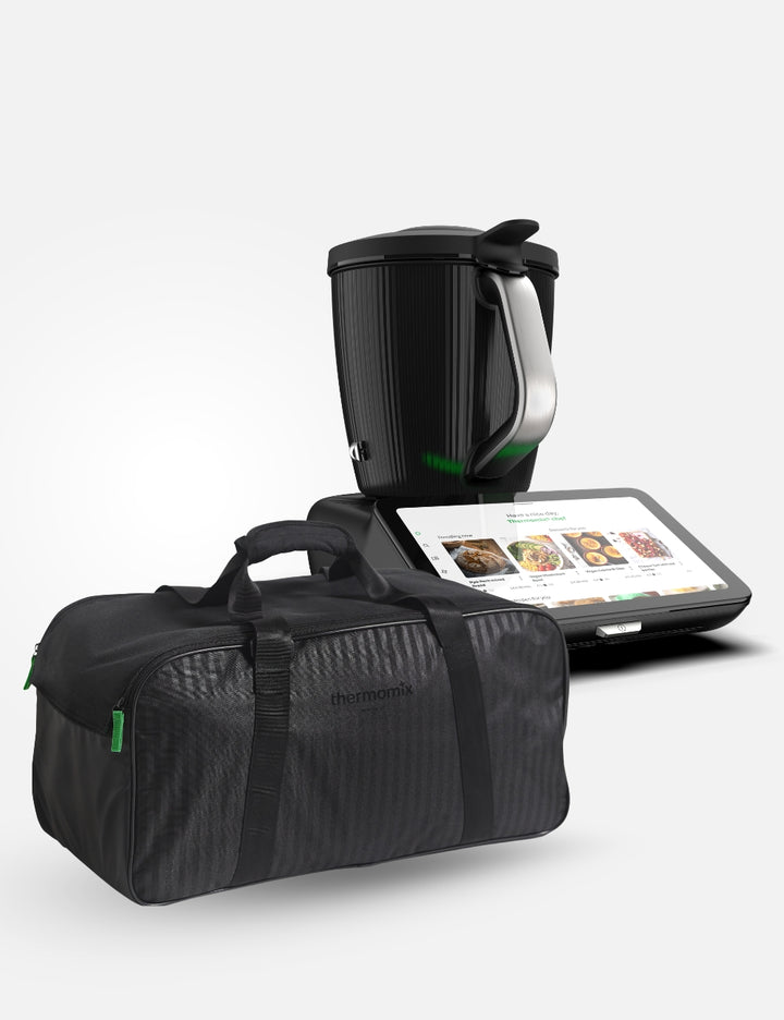 Black travel bag with the Thermomix Tm7 in the  background