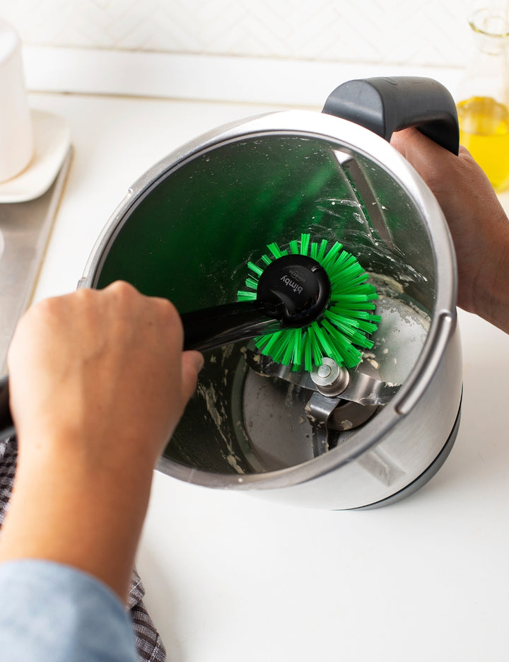 Thermomix® 2-in-1 Mixing Bowl Brush cleaning the inside of a Thermomix® mixing bowl with dual brush design for bowls and blades.
