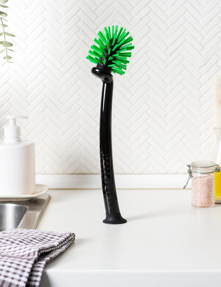 Thermomix® 2-in-1 Mixing Bowl Brush cleaning the inside of a Thermomix® mixing bowl with dual brush design for bowls and blades.