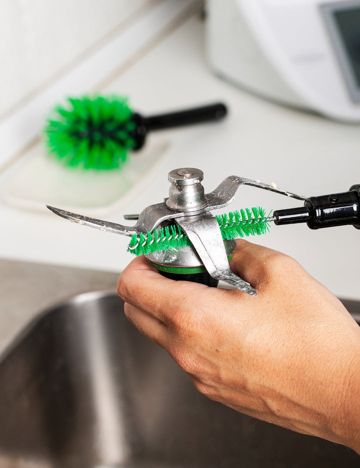 Thermomix® 2-in-1 Mixing Bowl Brush cleaning the inside of a Thermomix® mixing bowl with dual brush design for bowls and blades.
